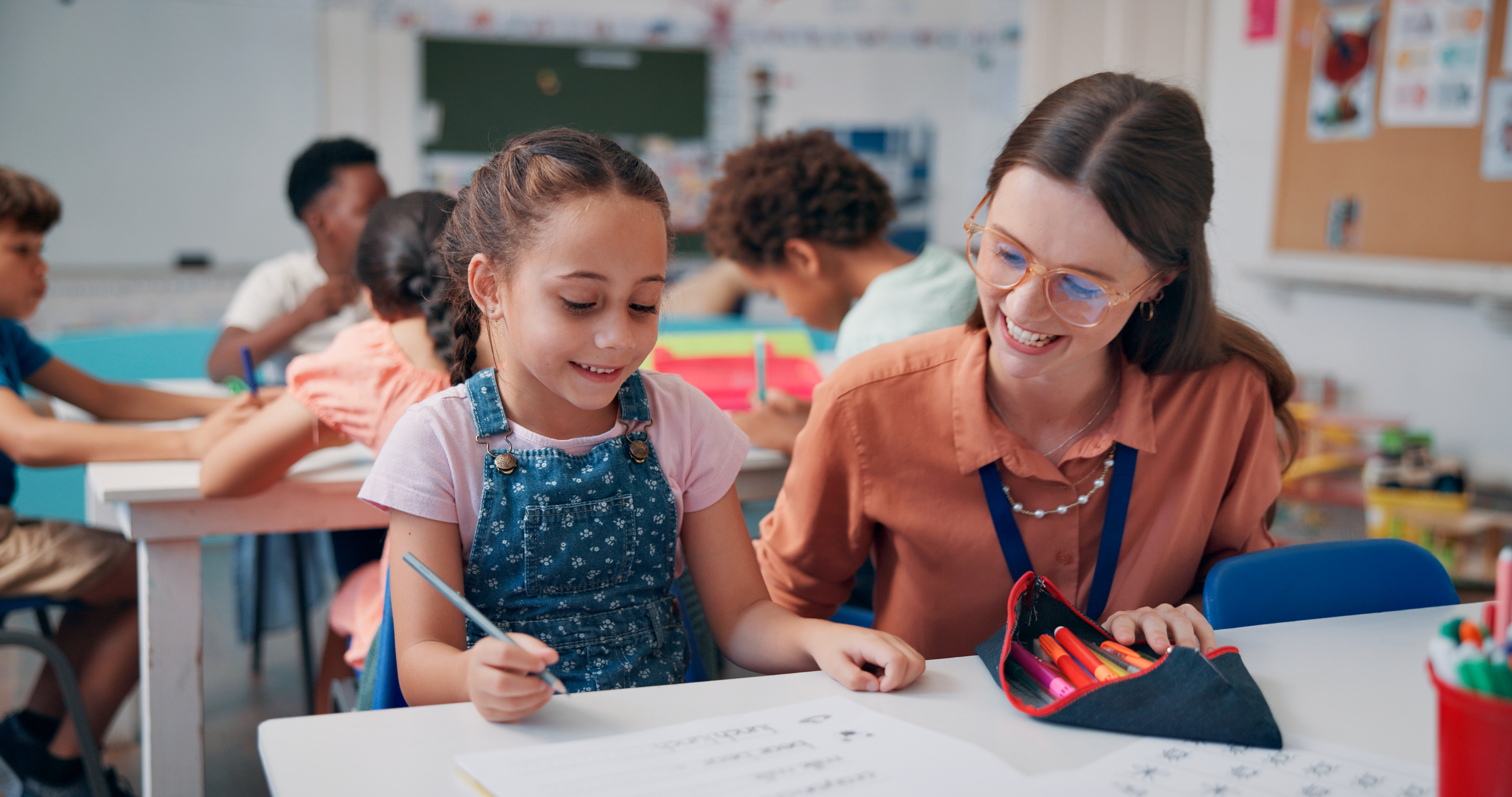 Teacher helping an elementary student